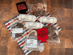 Nebraska beef subscription box layout - the meat is laid out on a red white and blue napkin